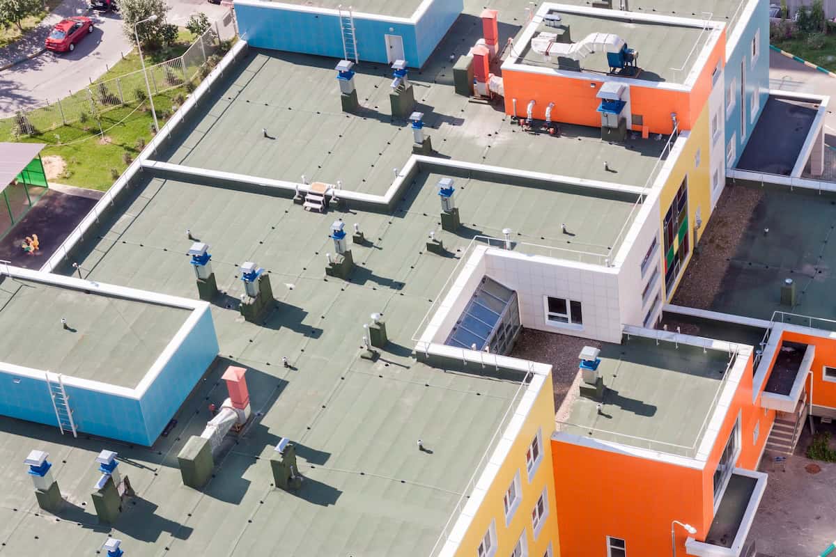 Top view flat roof with air conditioners and waterproofing layer