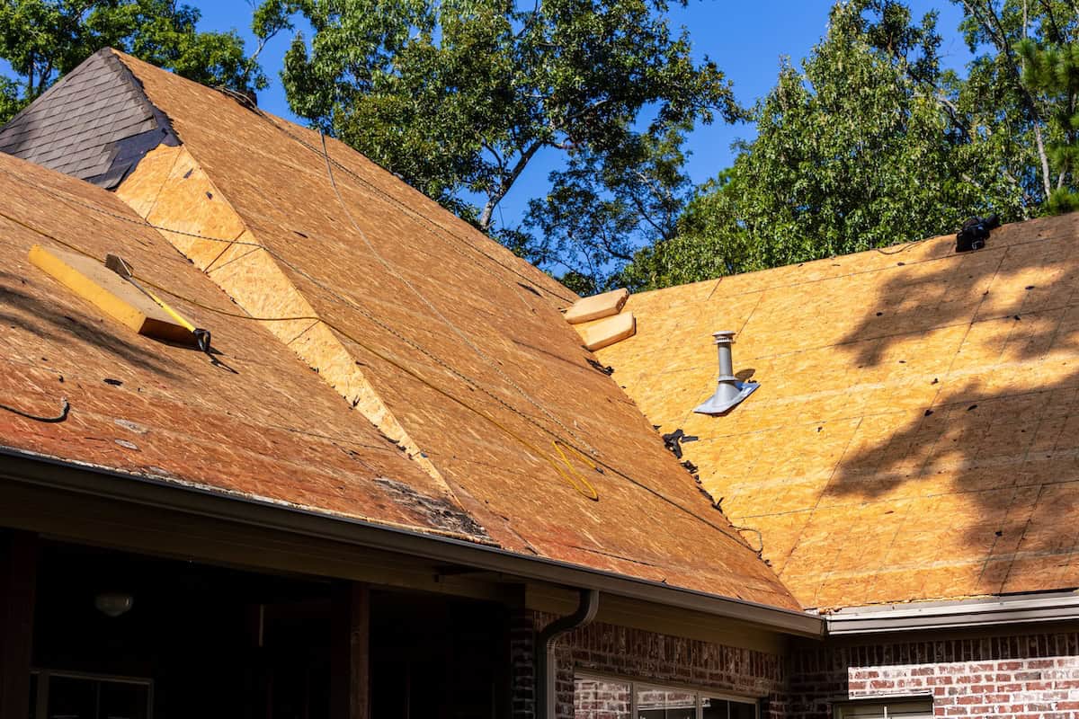Roof decking exposed as homeowners wait for new roof