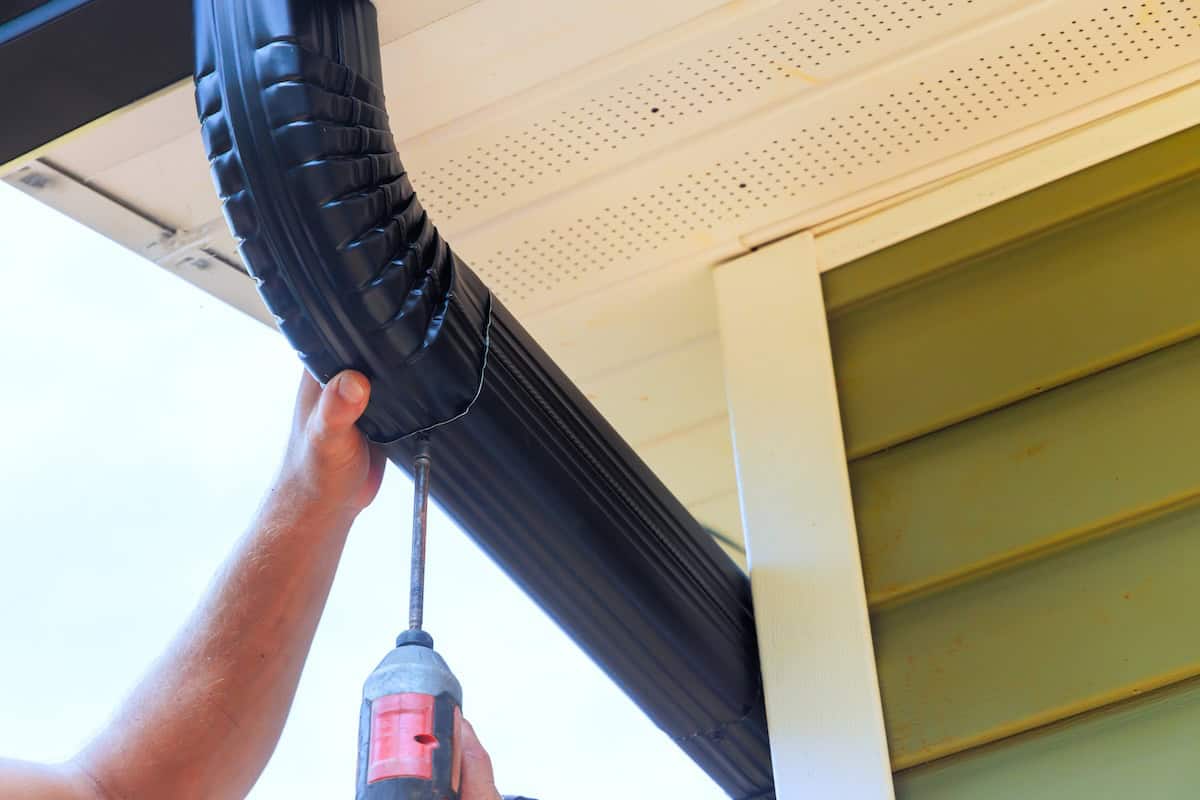 installation of rain gutters on roof