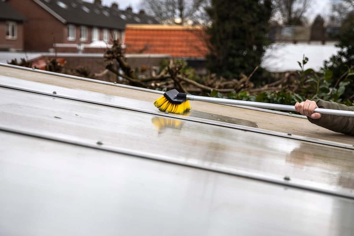 Washing the roof with a soft bristle brush