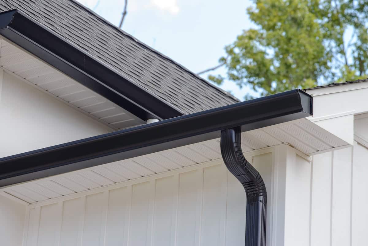 rain gutter of roof with downpipe metal corner wall rooftop