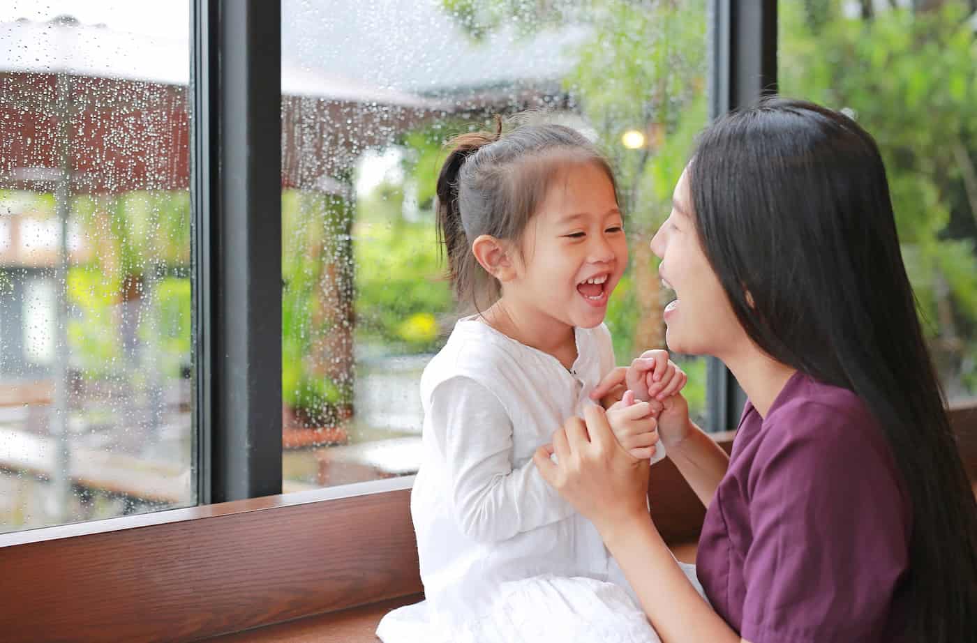 mother and daughter inside during storm