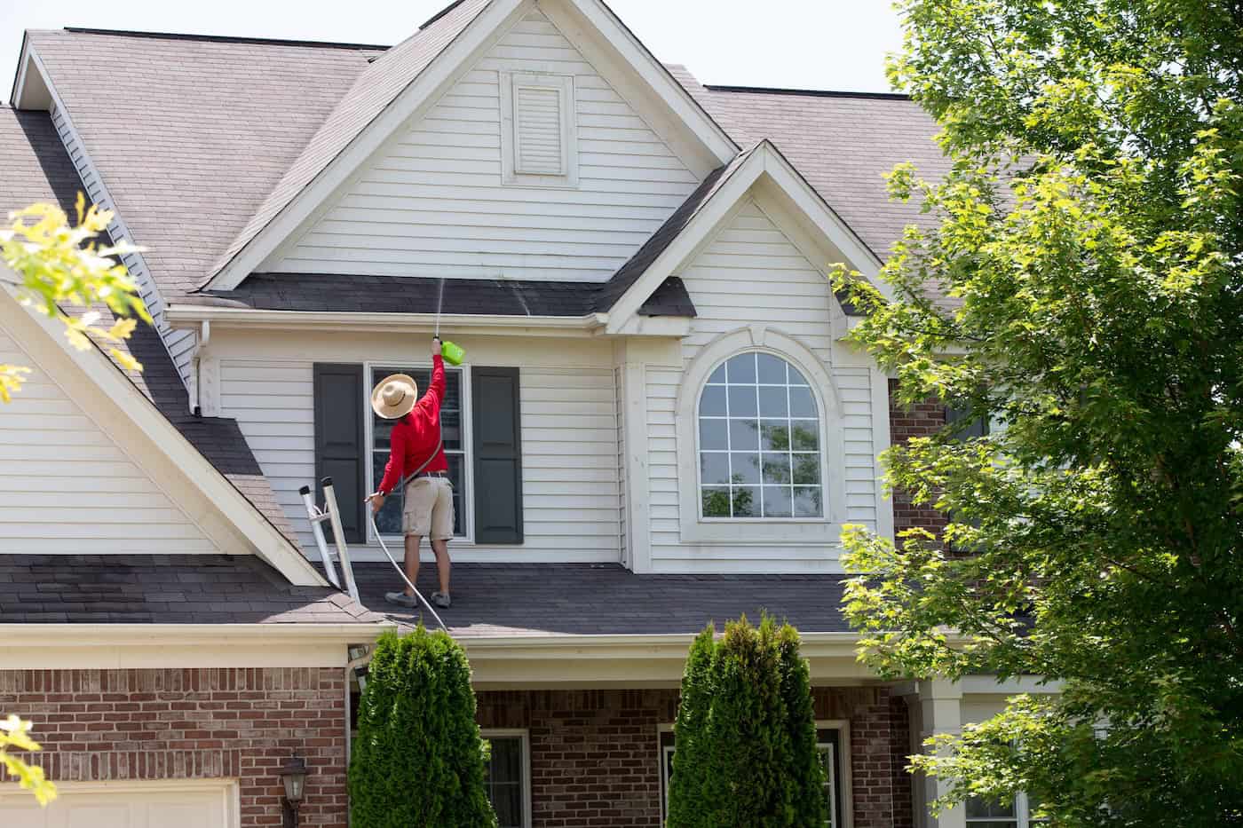 Waterproofing coating being applied to flat roof
