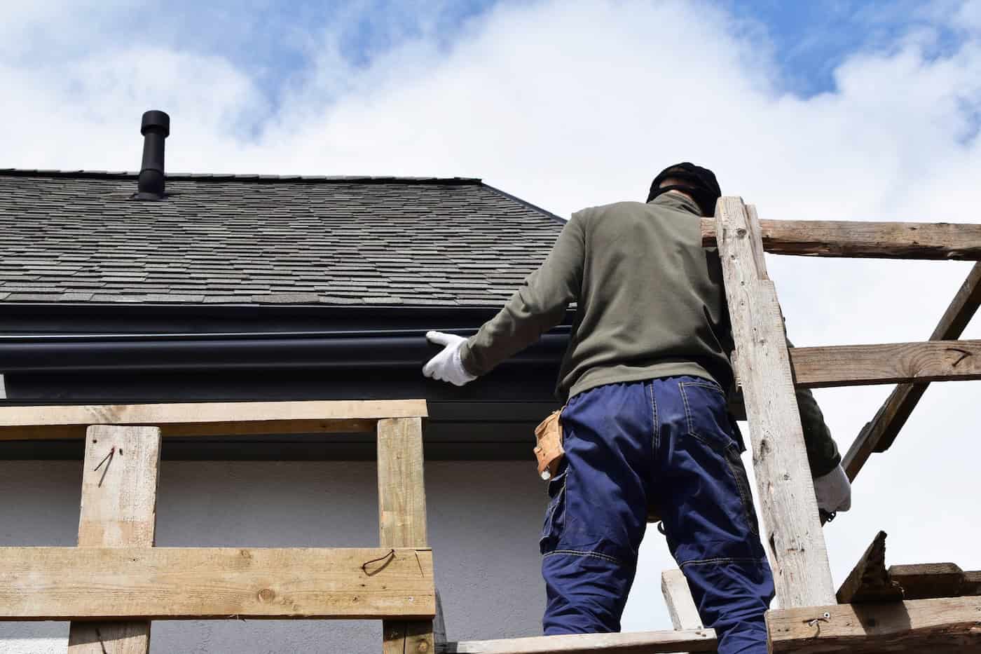 roofer fixing gutter