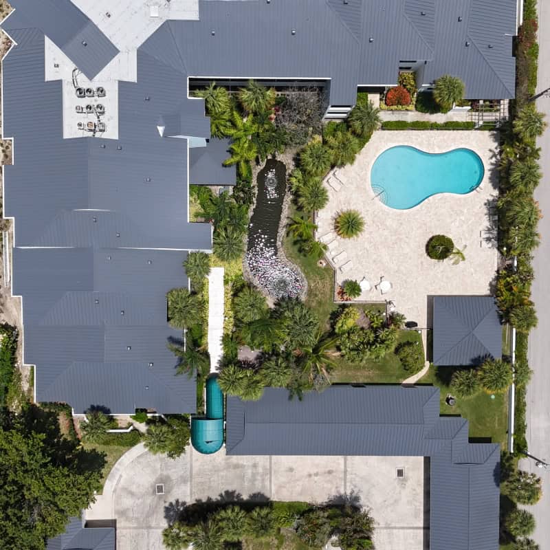 Photo of a partially cleaned metal roof to show the stark contrast between cleaned and not cleaned.